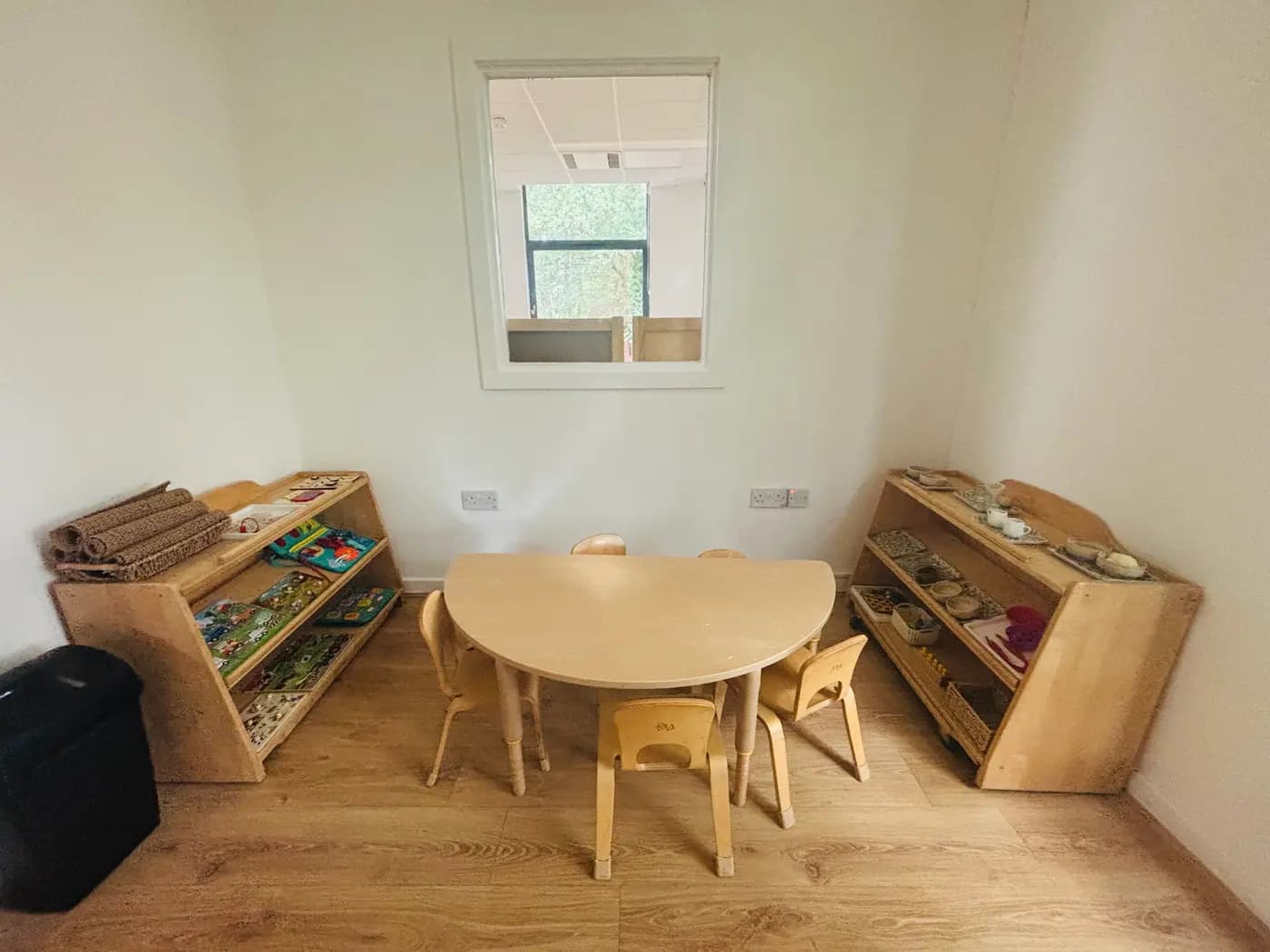 Montessori practical life shelves at Blue Nest Aldershot, where children build the independence needed for Reception