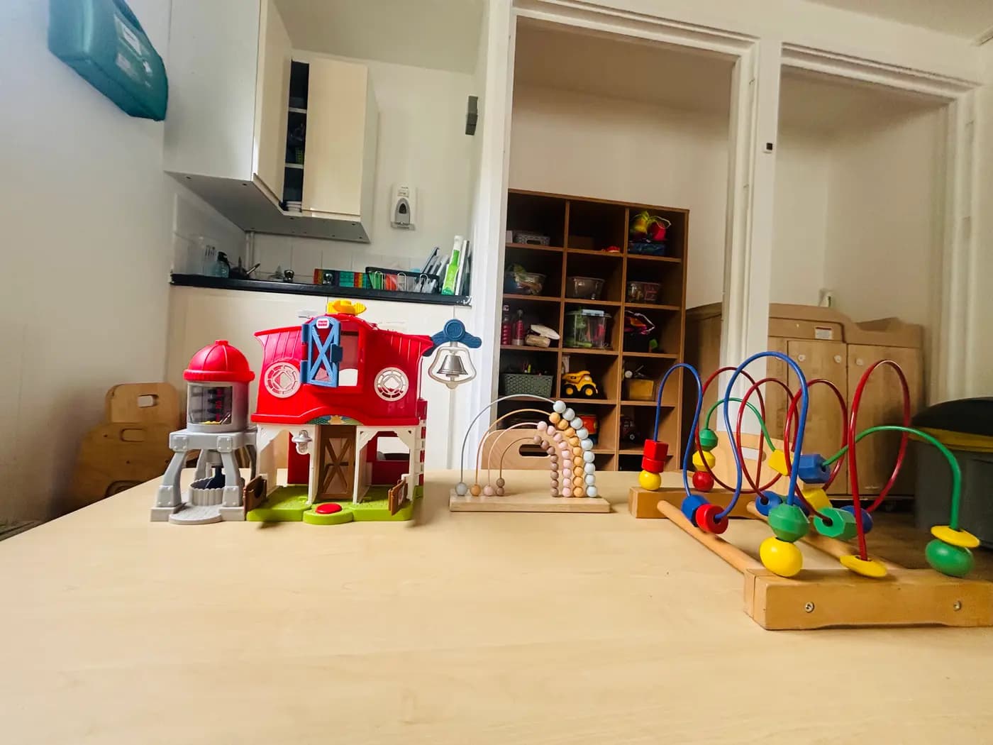 Wooden and sensory toys arranged ready for the day at Blue Nest Montessori Aldershot