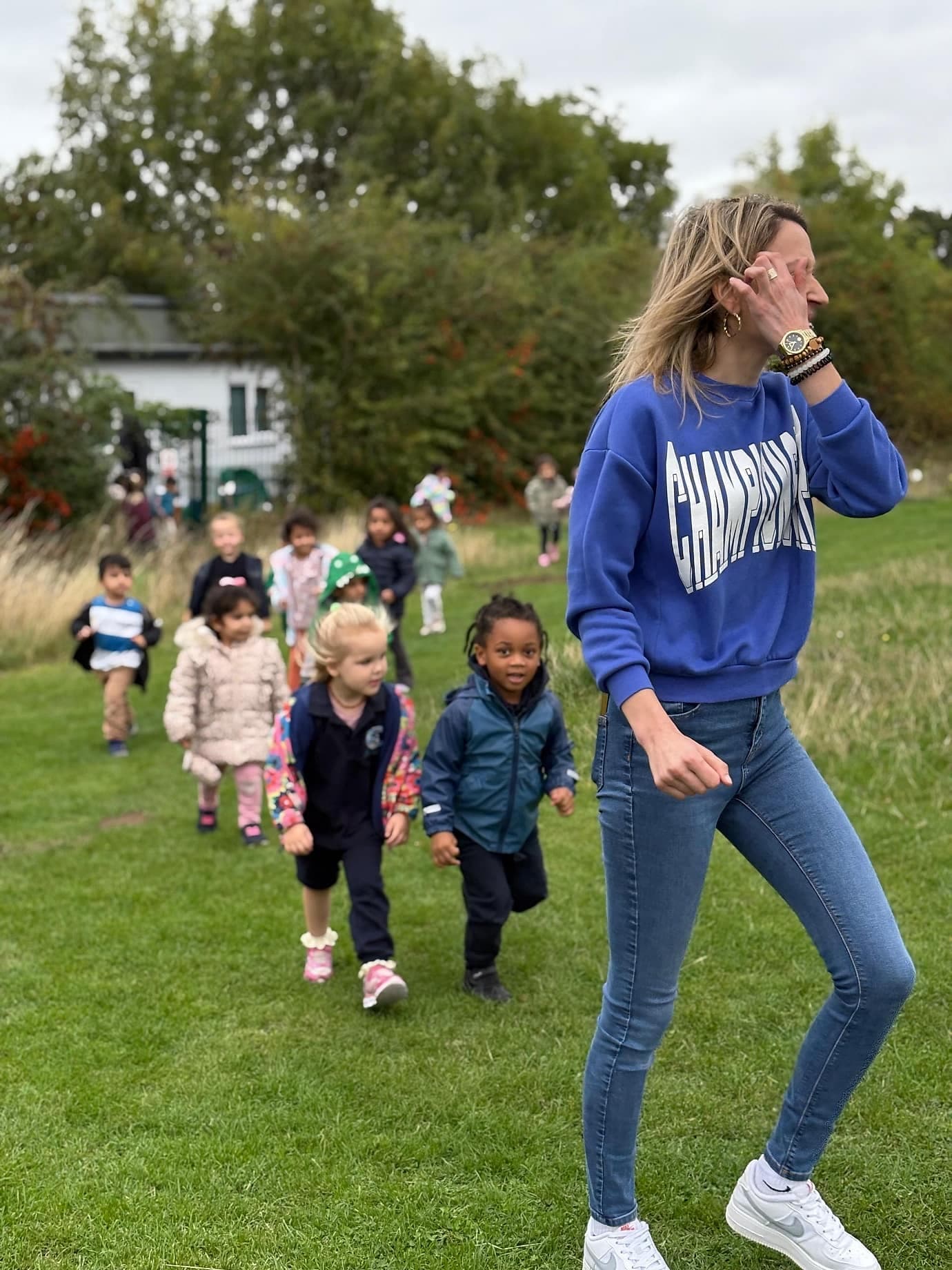 Families walking and playing together on the open green
