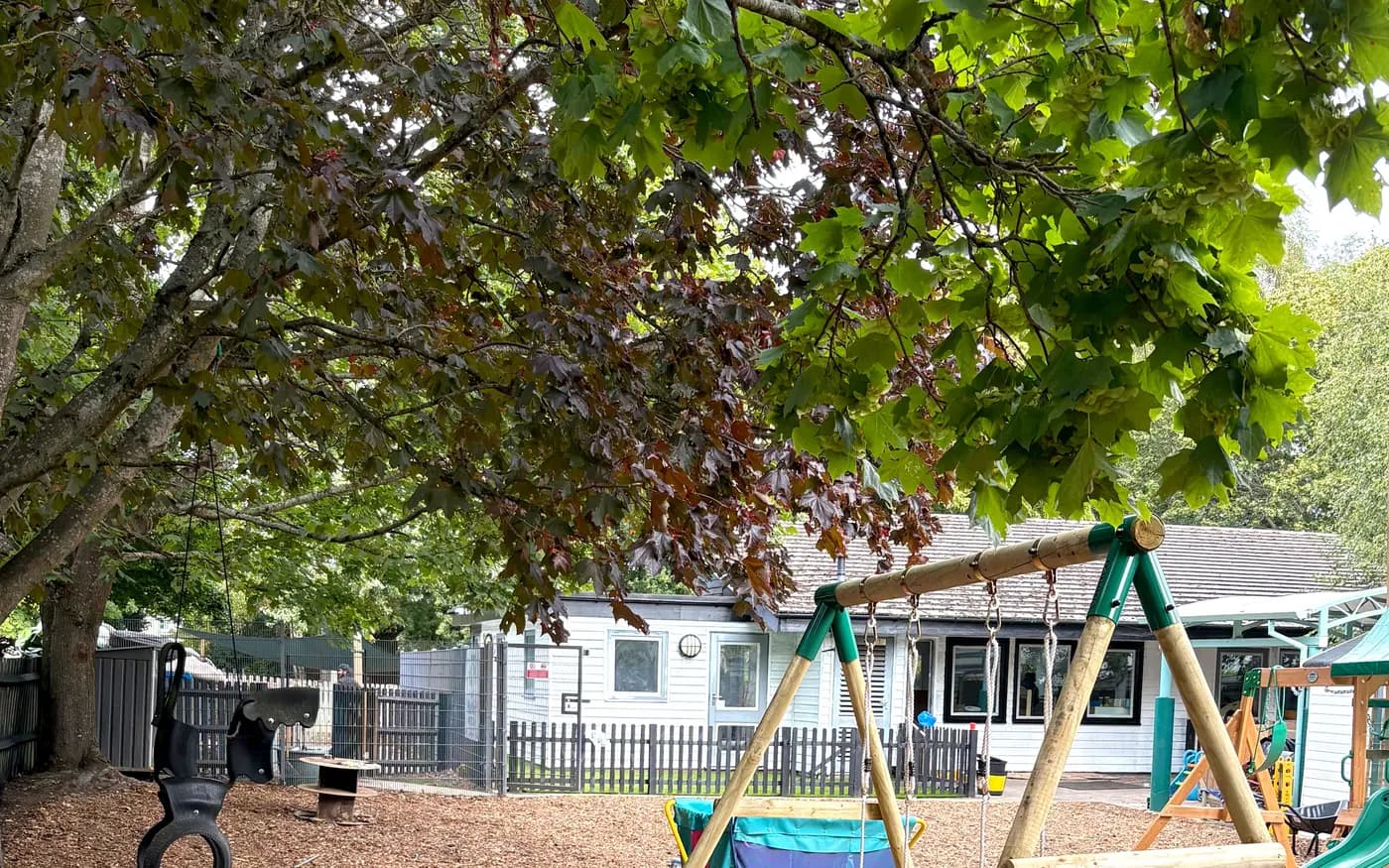 The outdoor play and learning area at Blue Nest, under the trees